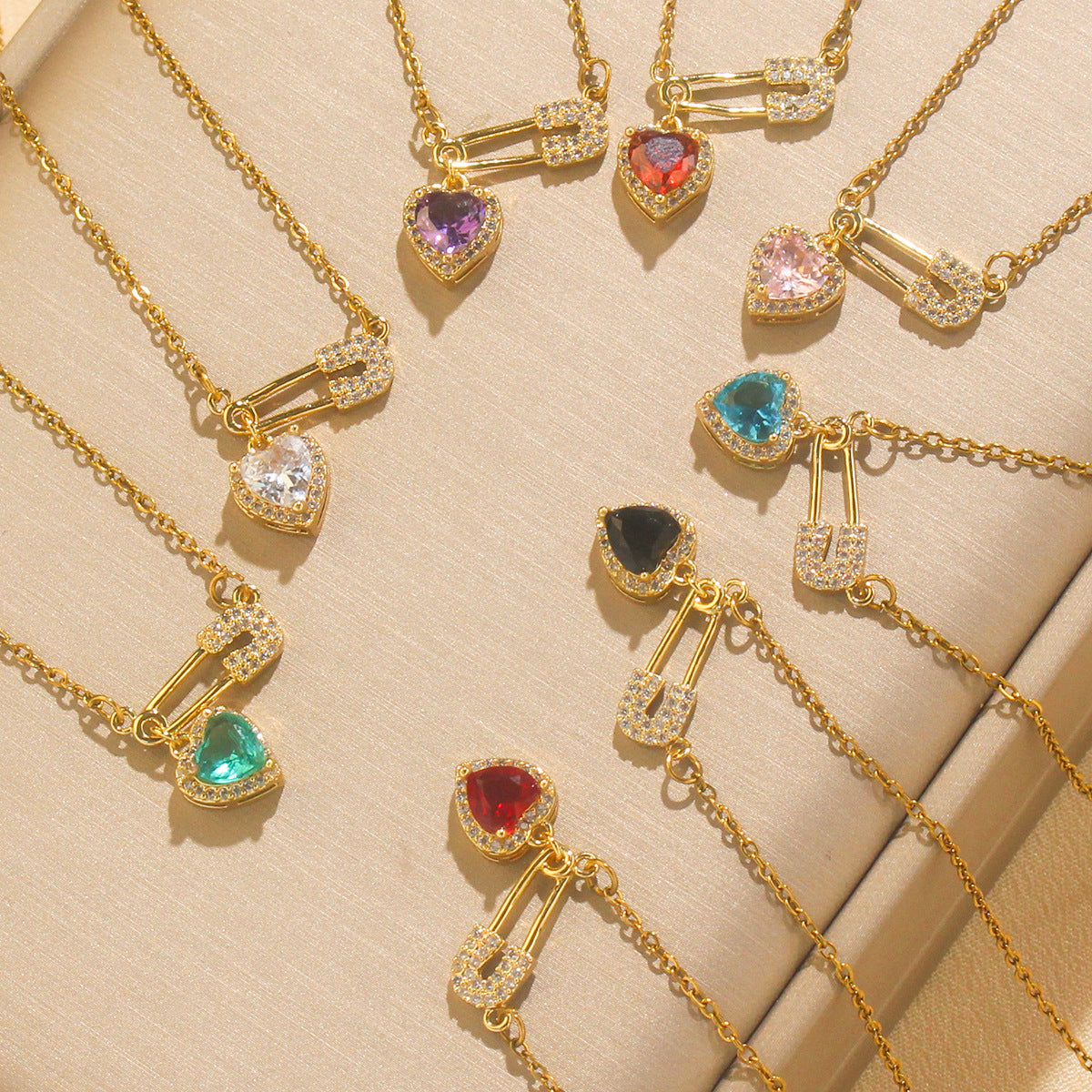 Women’s Dainty Safety Pin Necklace with Pink Heart and Sparkling Stone Detail
