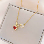 Women’s Dainty Safety Pin Necklace with Pink Heart and Sparkling Stone Detail