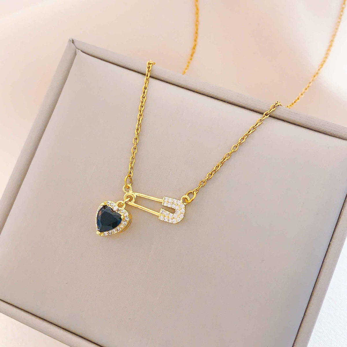 Women’s Dainty Safety Pin Necklace with Pink Heart and Sparkling Stone Detail