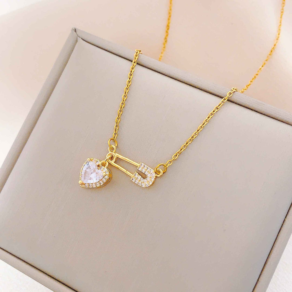 Women’s Dainty Safety Pin Necklace with Pink Heart and Sparkling Stone Detail